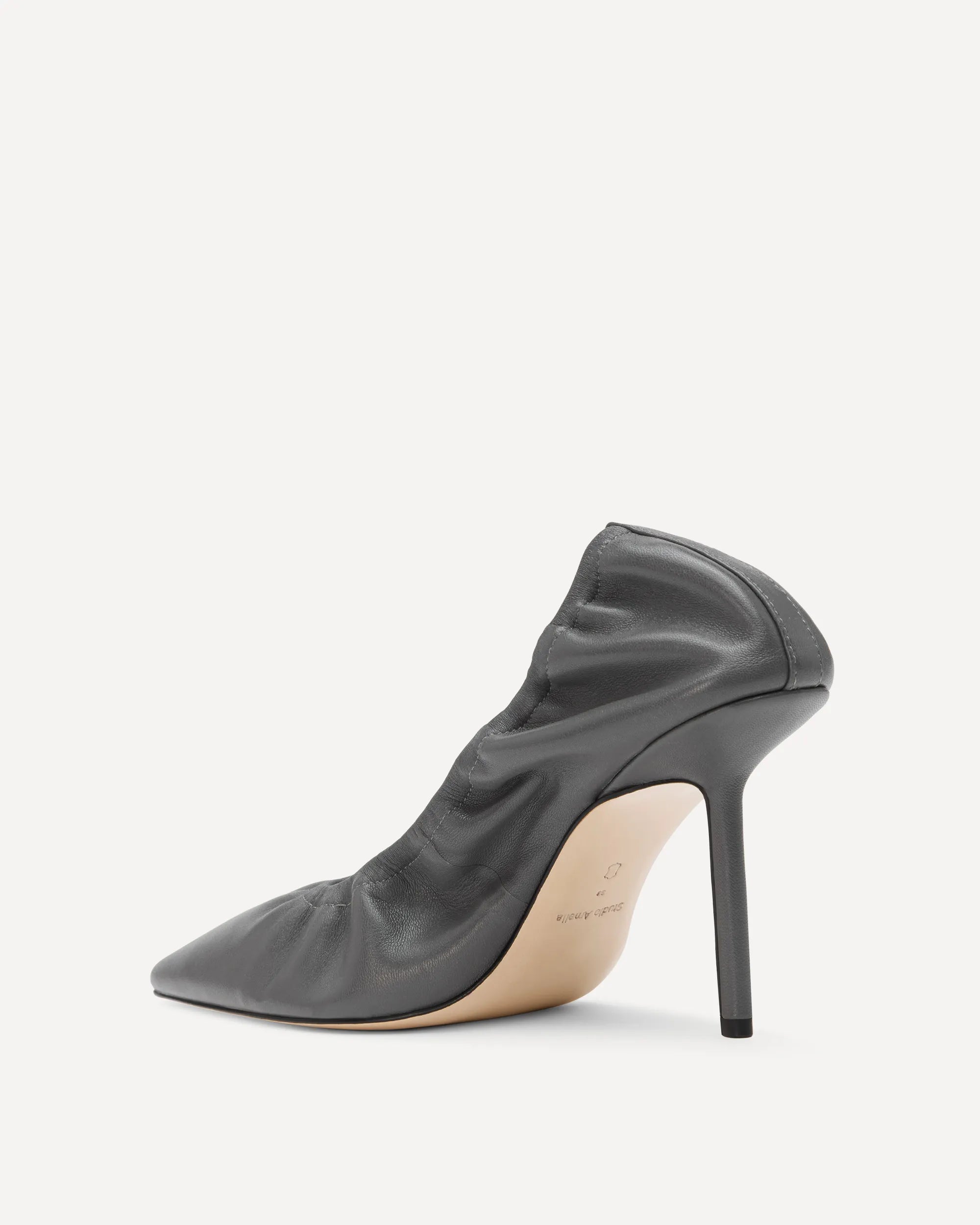 A gray leather pointed pump