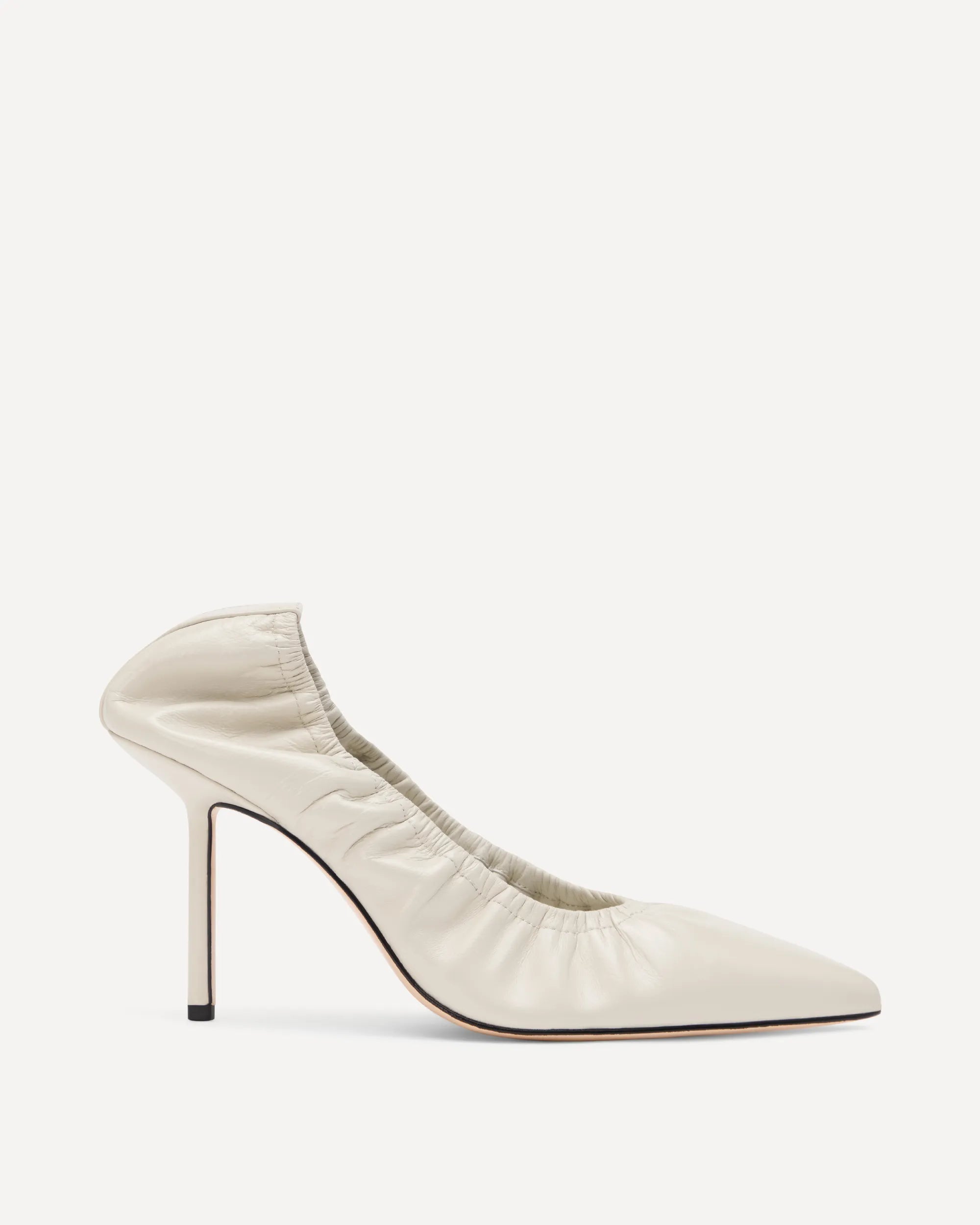 A cream coloured high heel with a closed pointed toe