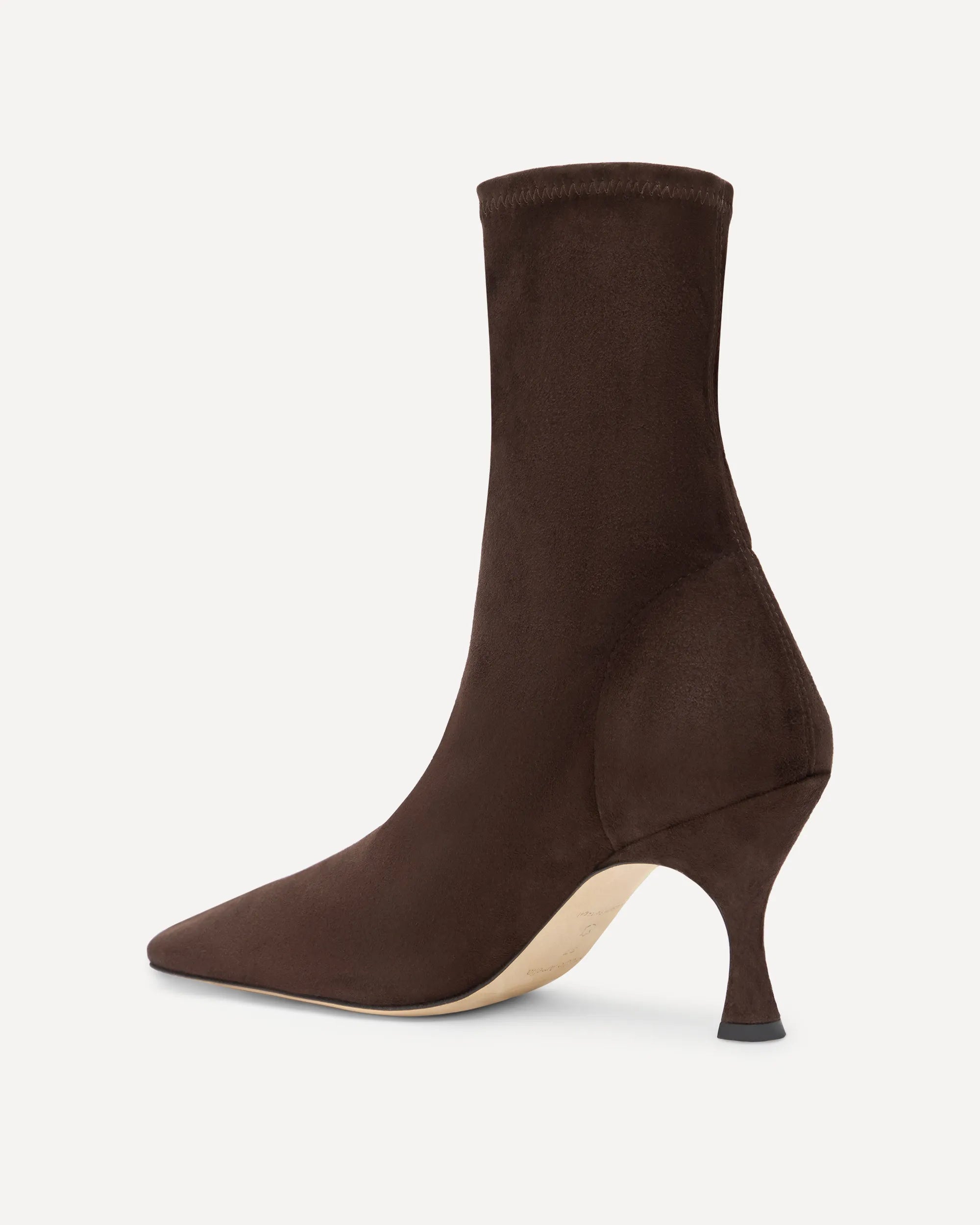 A dark brown suede boot with a mid heel