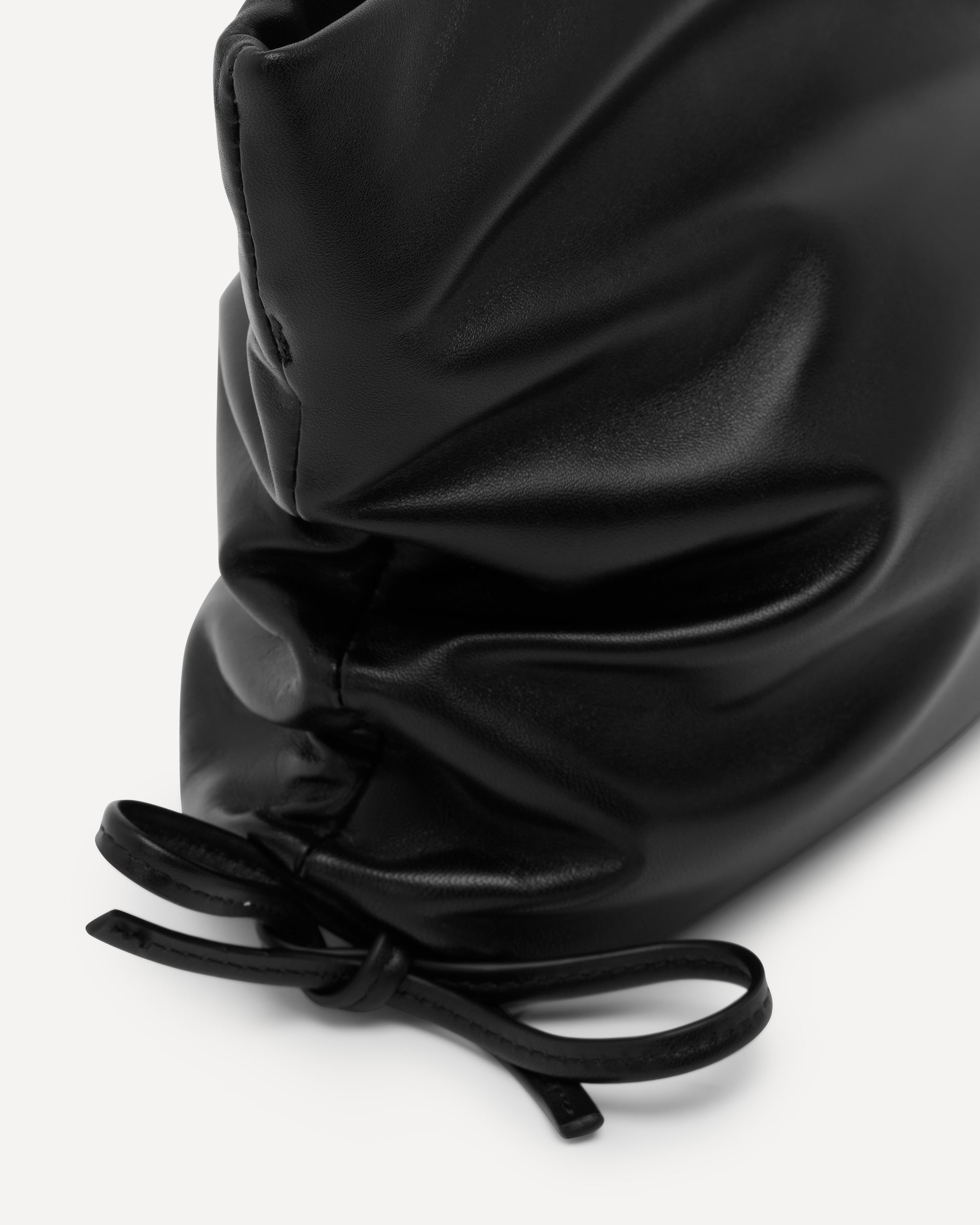 Black drawstring clutch on a white background