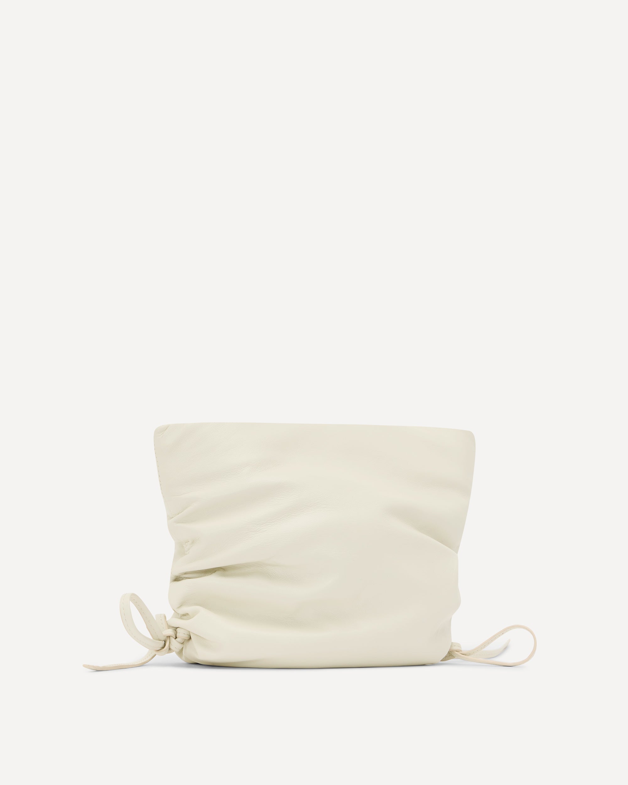 Cream drawstring pouch on a white background