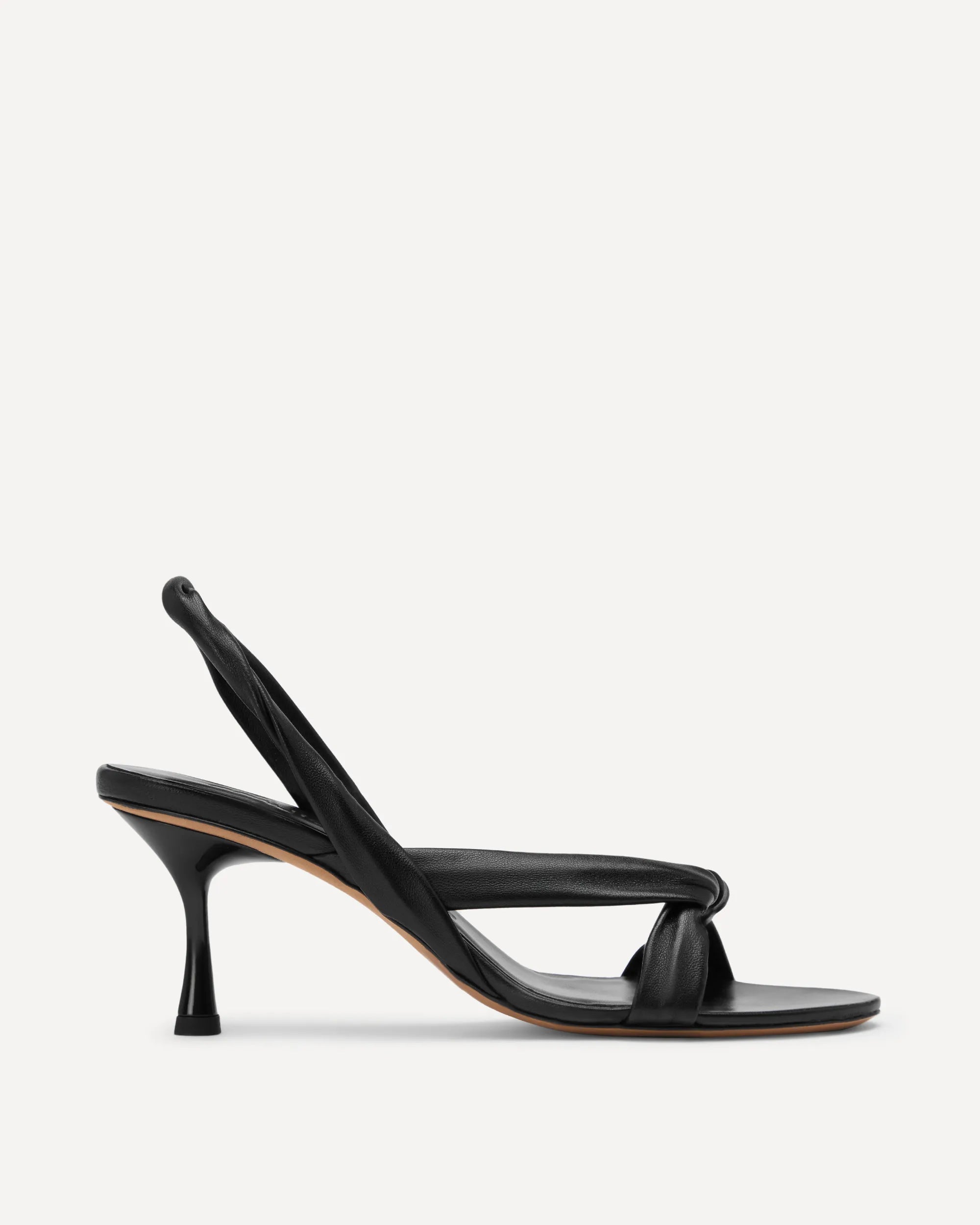 Black high-heeled sandal on a light gray background