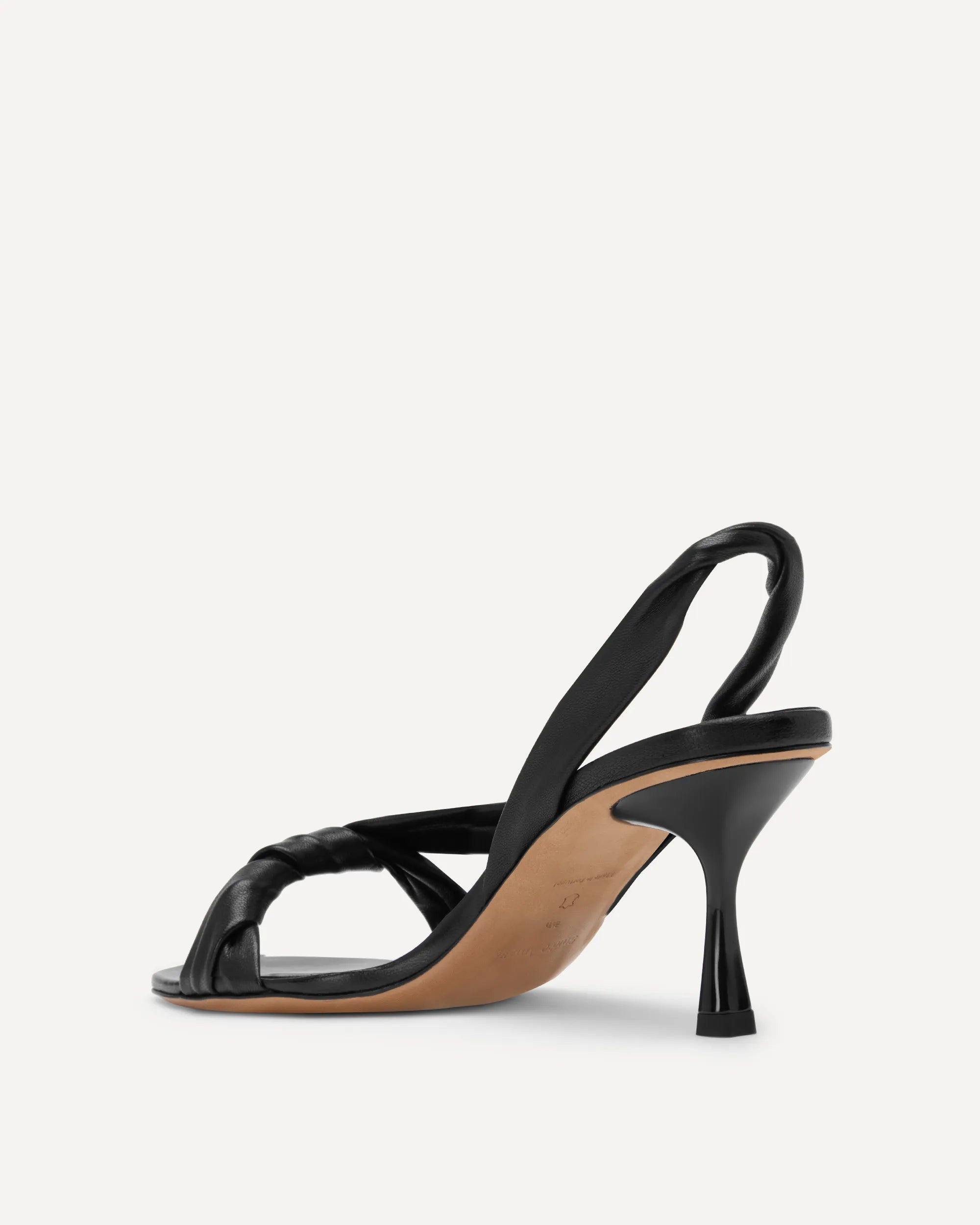 A black strappy sandal with a slingback design