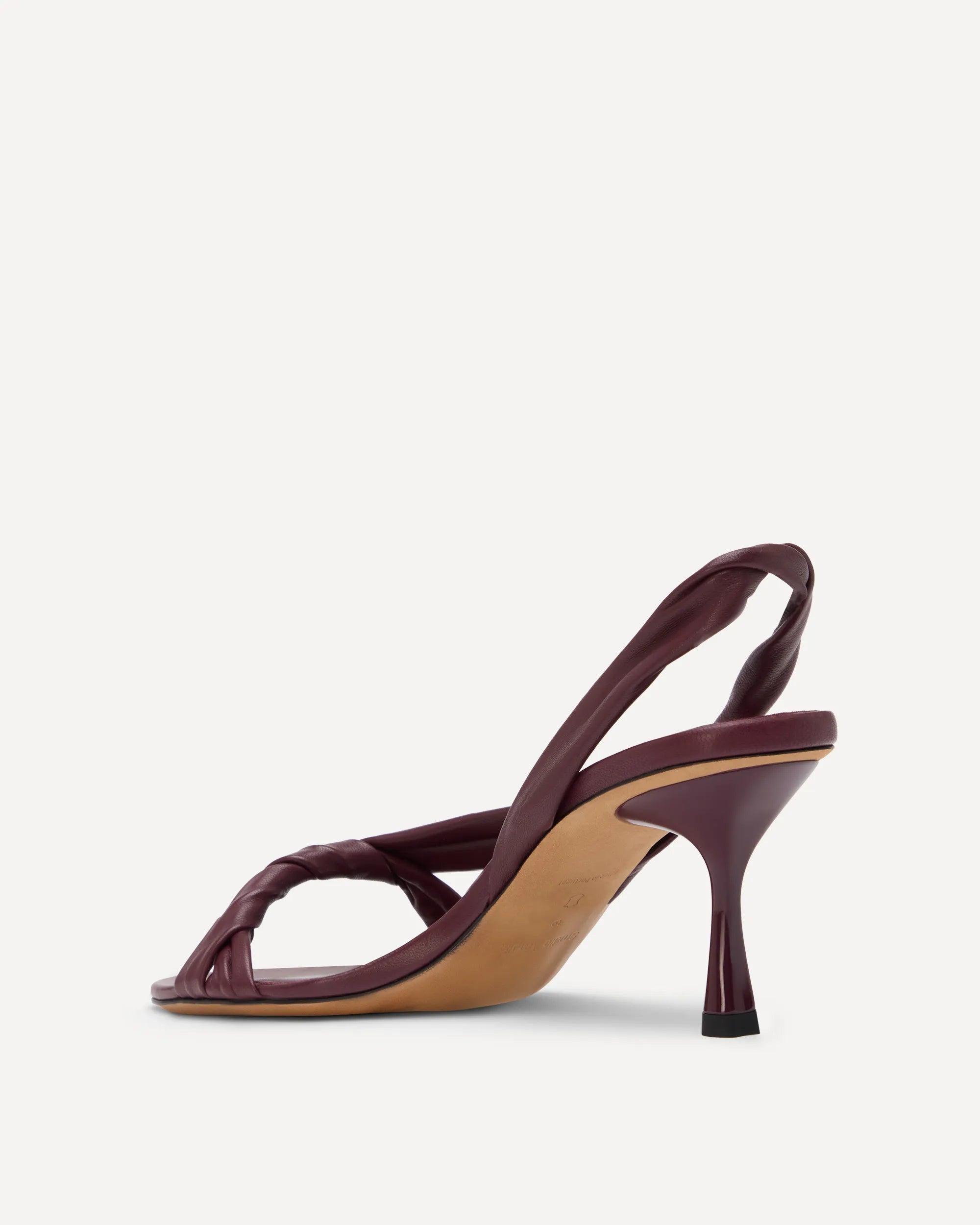 A burgundy slingback sandal with a high heel