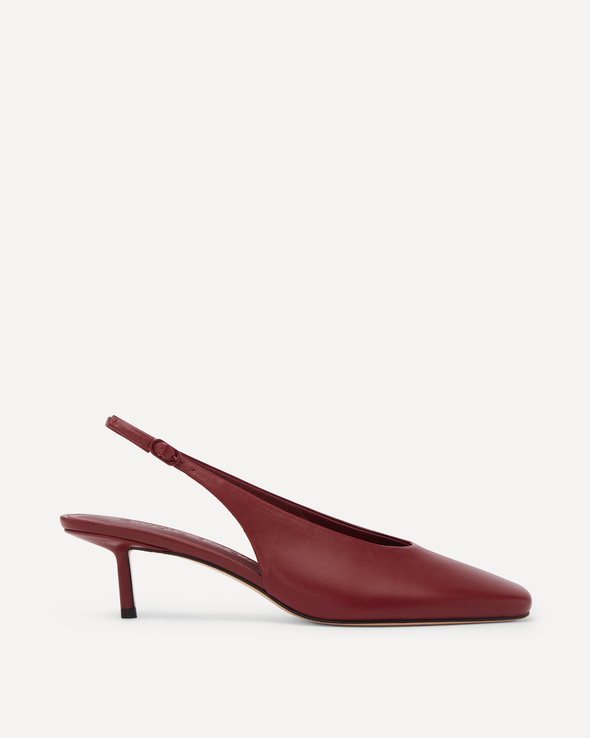 Maroon slingback shoe on a white background