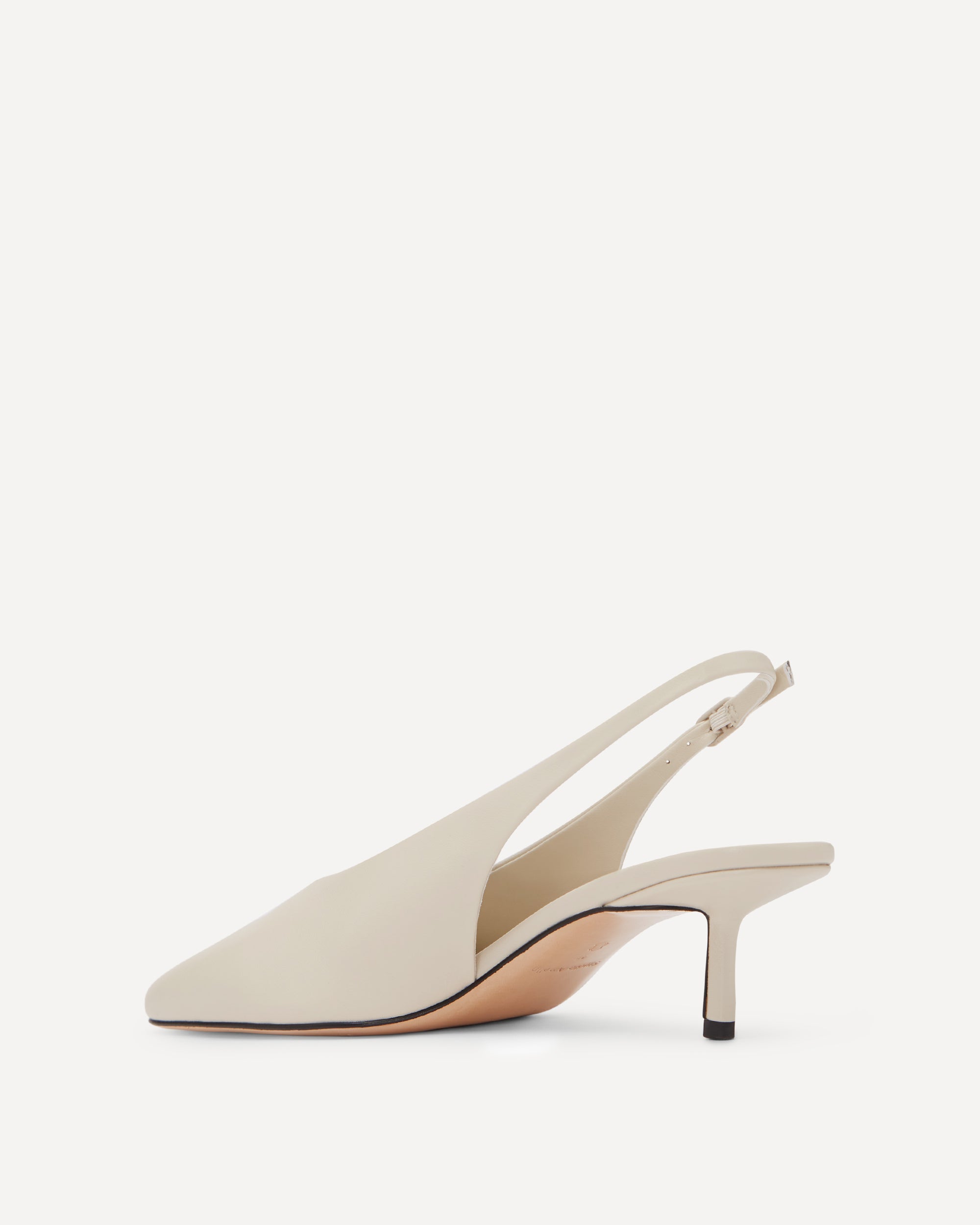 White slingback shoe on a white background