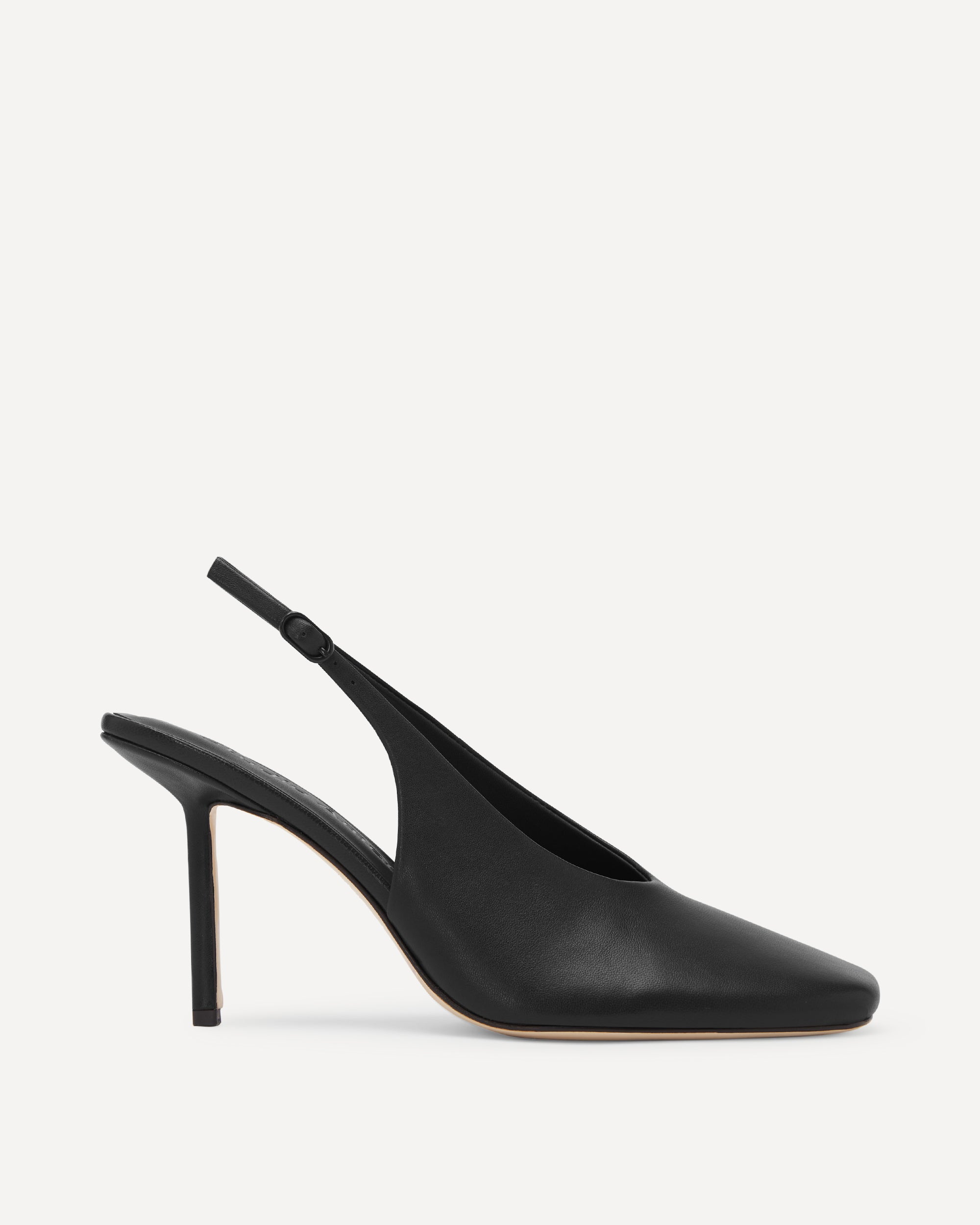Black leather high heeled pumps on a white background