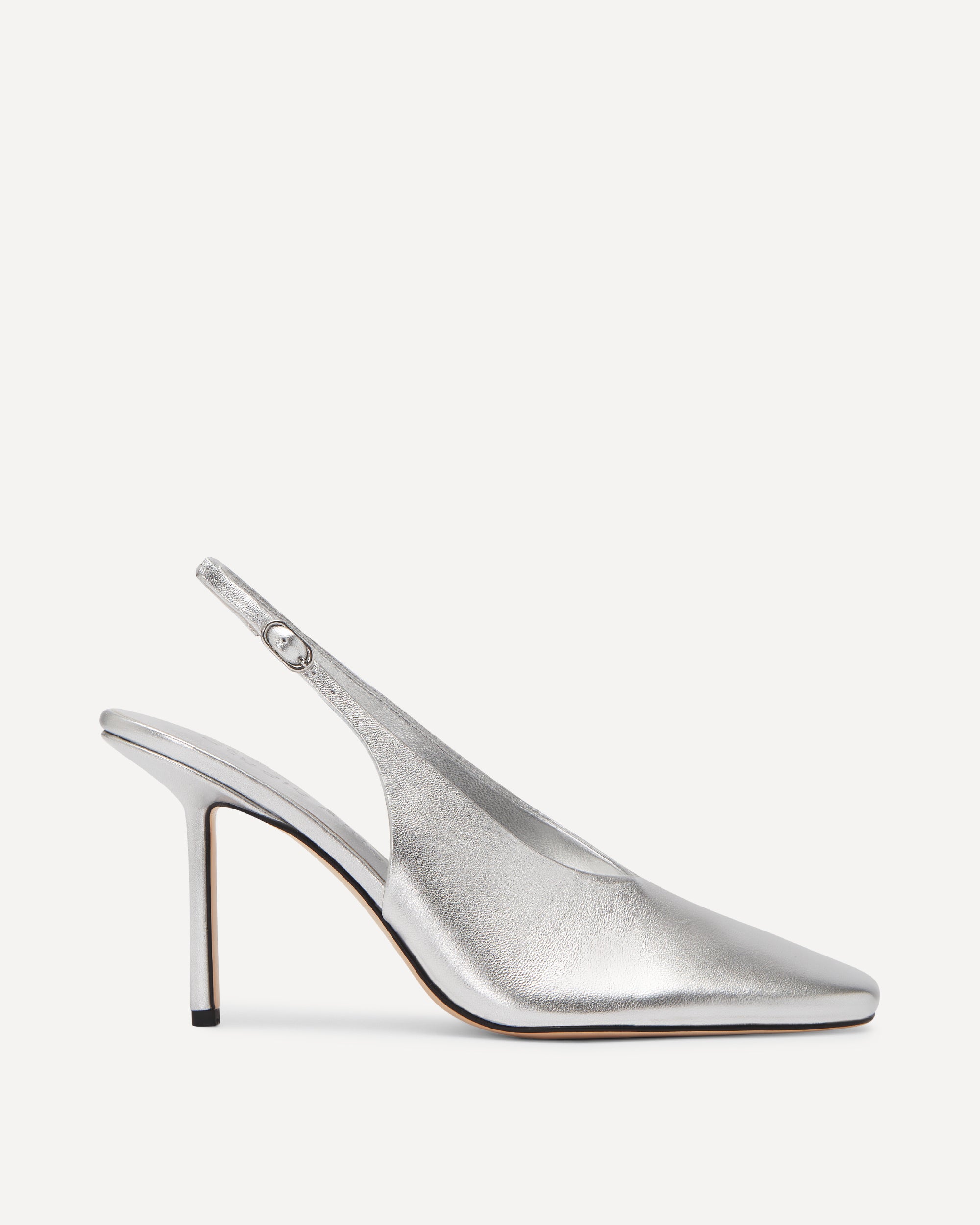 Silver slingback pump on a white background