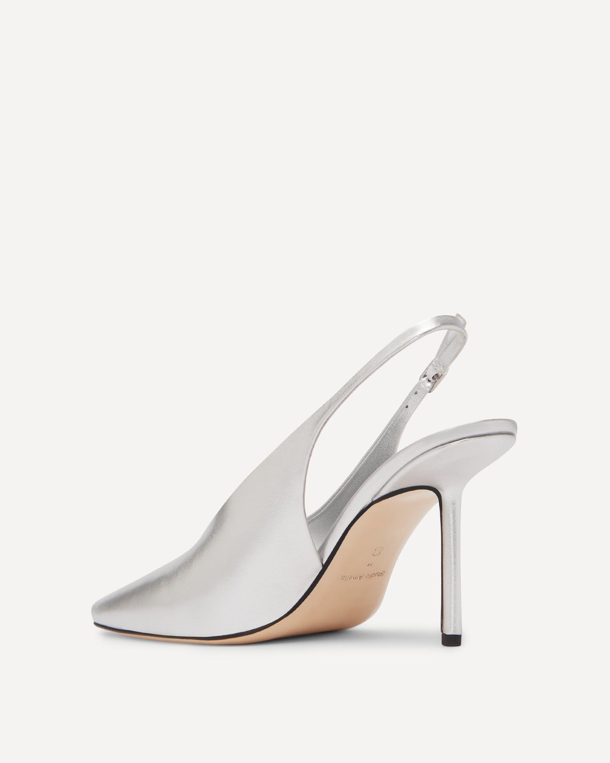 Silver high-heeled shoe on a white background