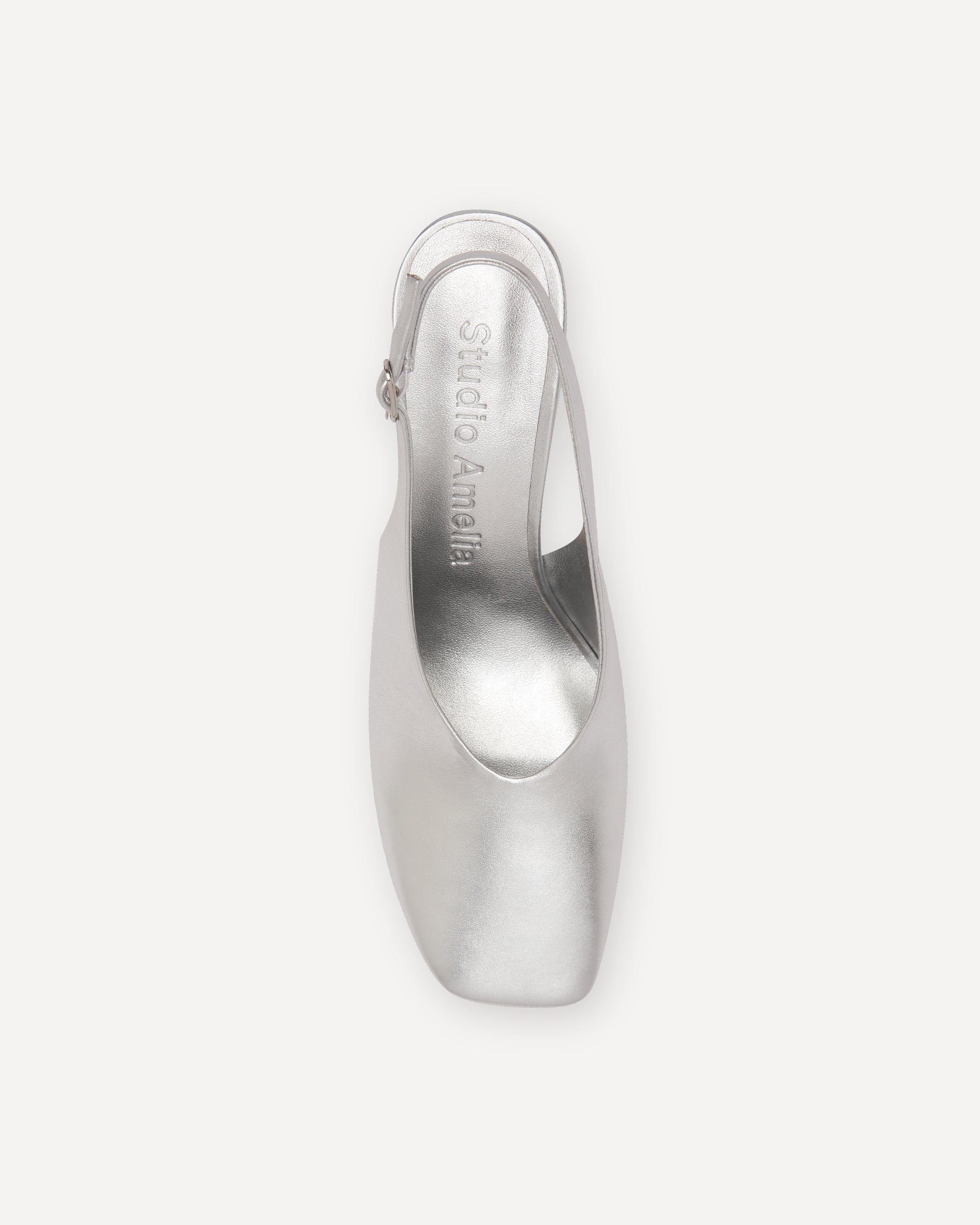 Silver high-heeled shoe on a white background