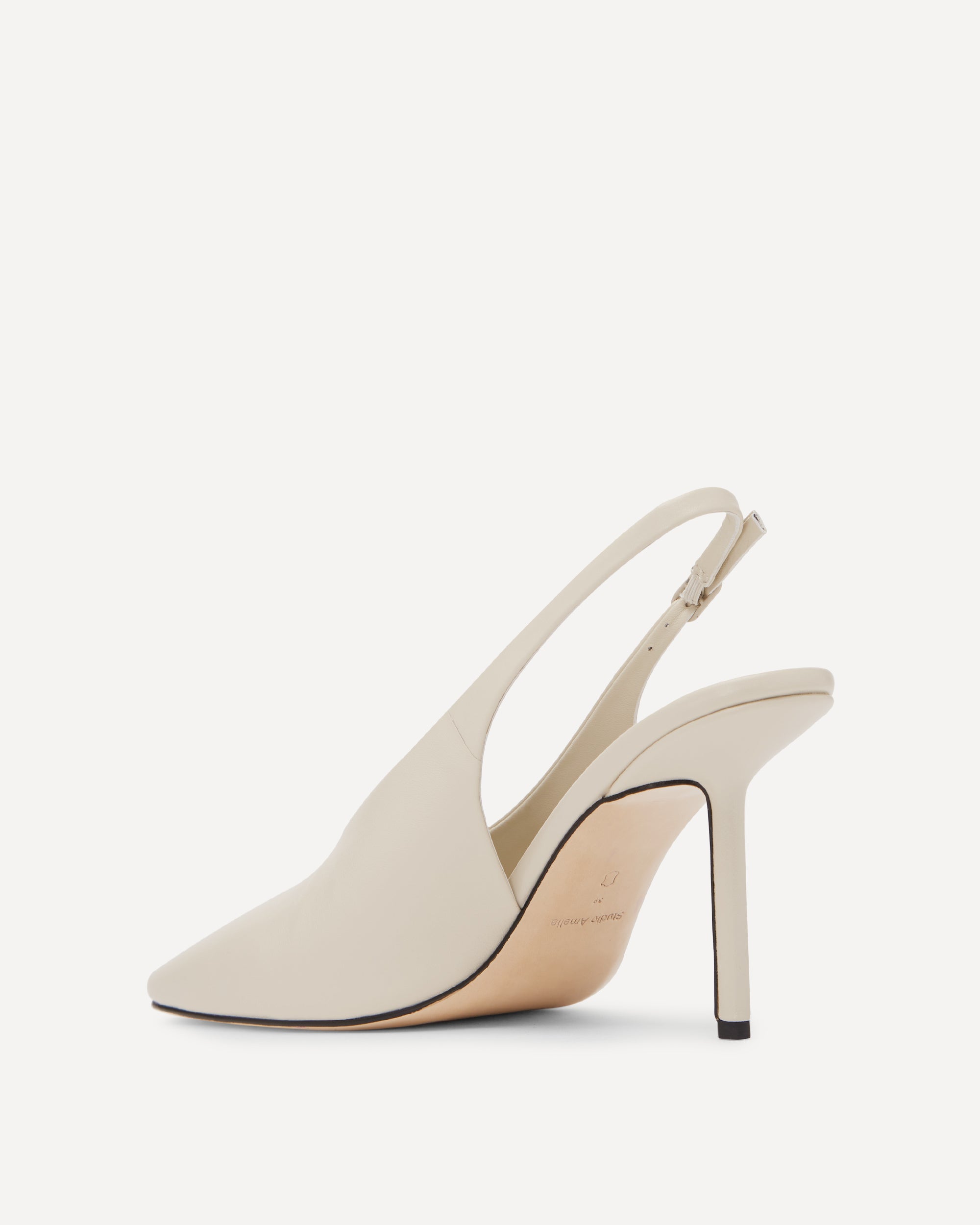 Stone coloured leather high heels on a white background