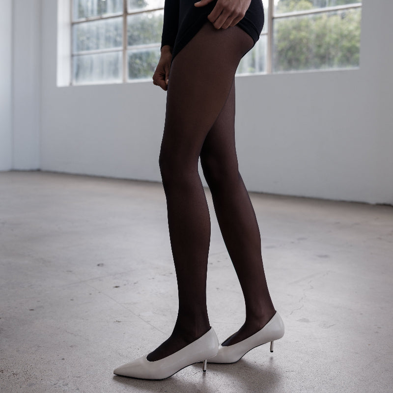 A pair of stone coloured kitten heels made from leather