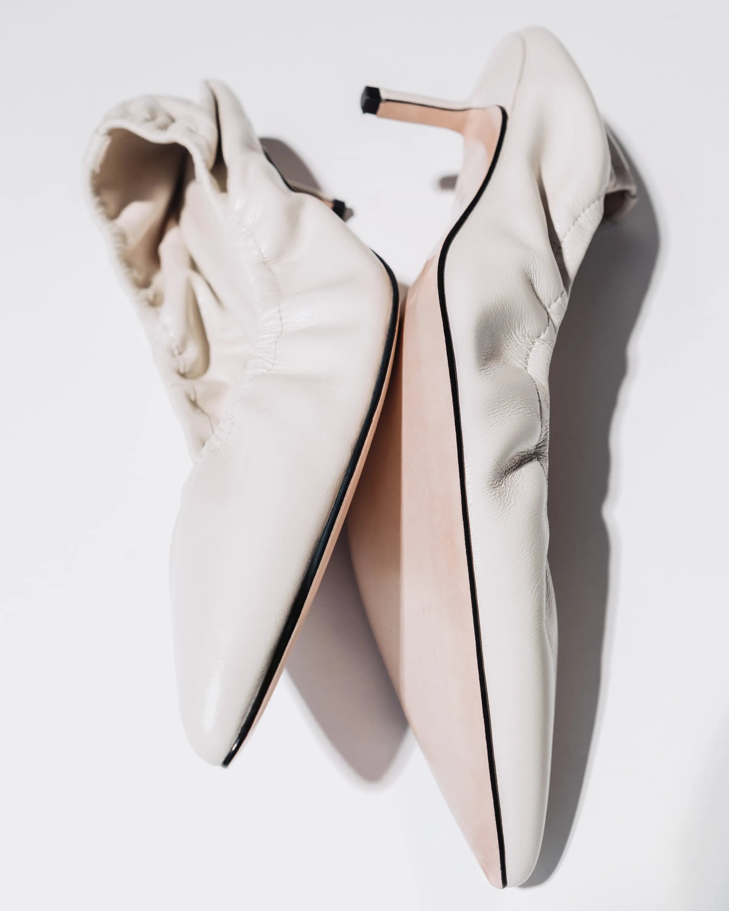 White coloured kitten heels 