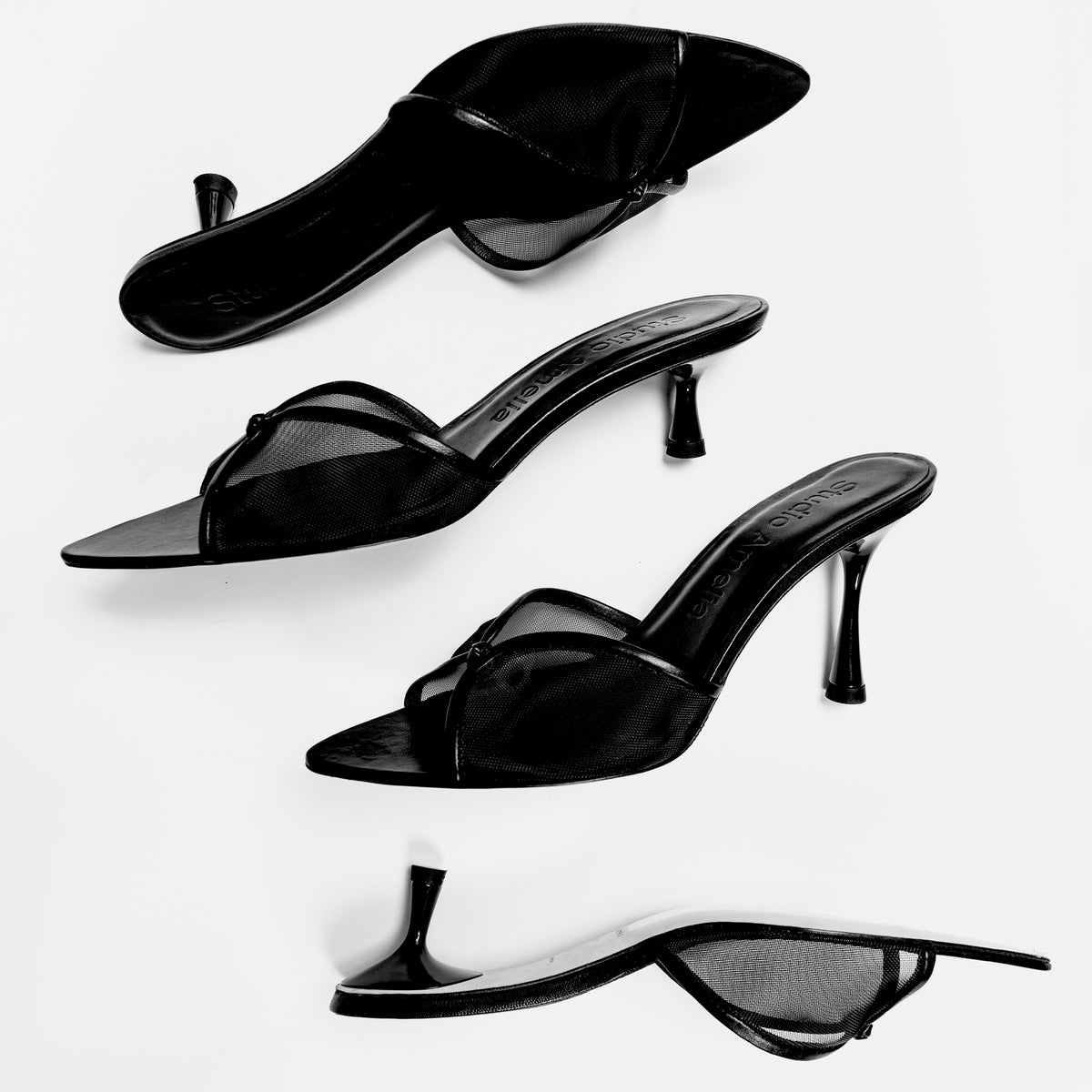Black pointed sandals with kitten and high heels by Studio Amelia