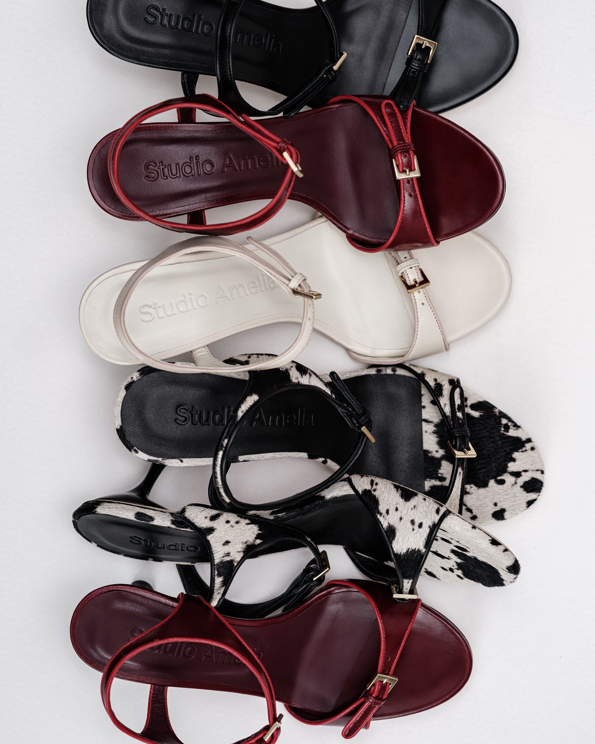 A collection of open toed leather sandals by Studio Amelia