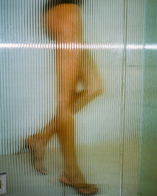 A woman wearing the Wishbone 90 Sandal by Studio Amelia