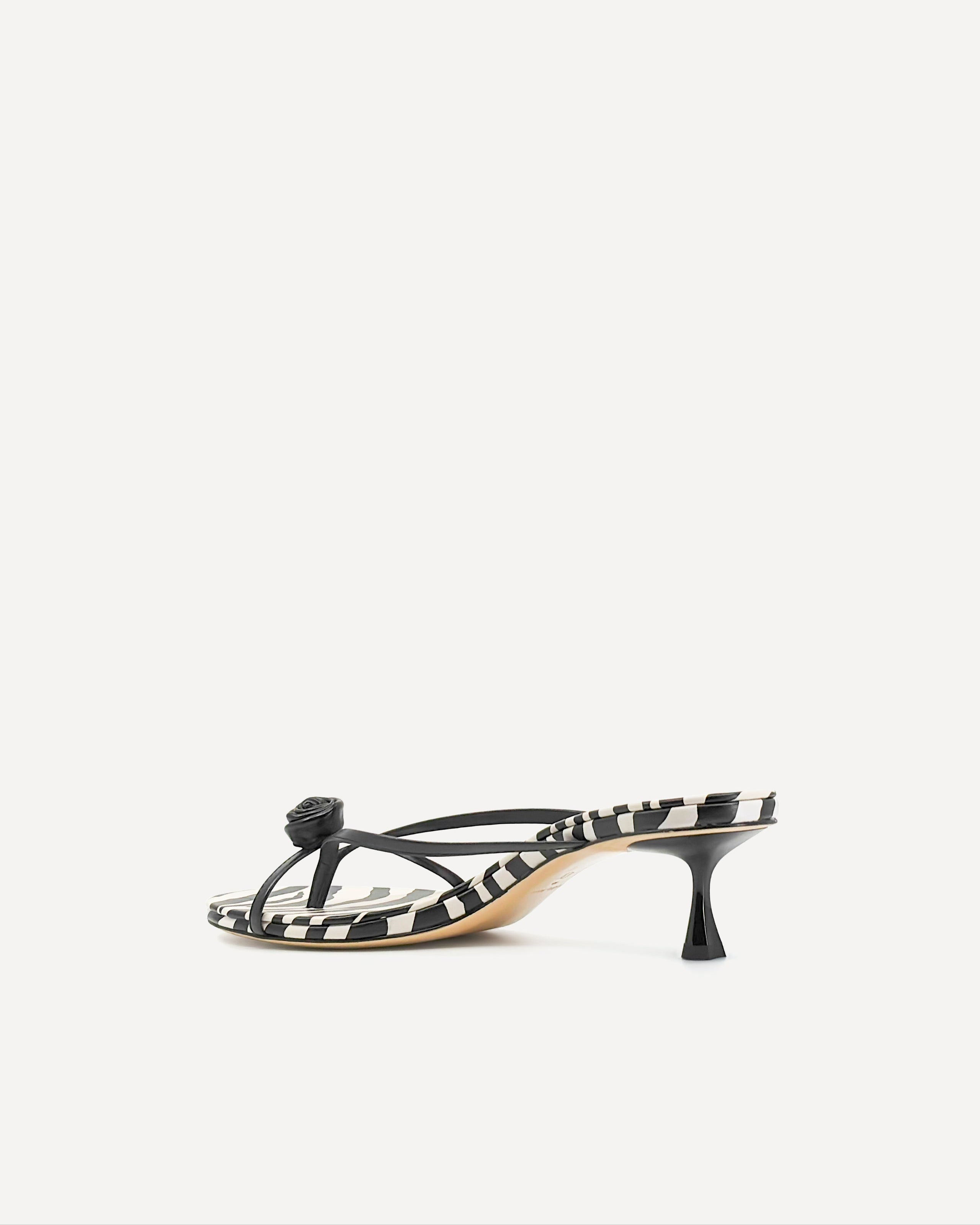 A black leather kitten heel sandal