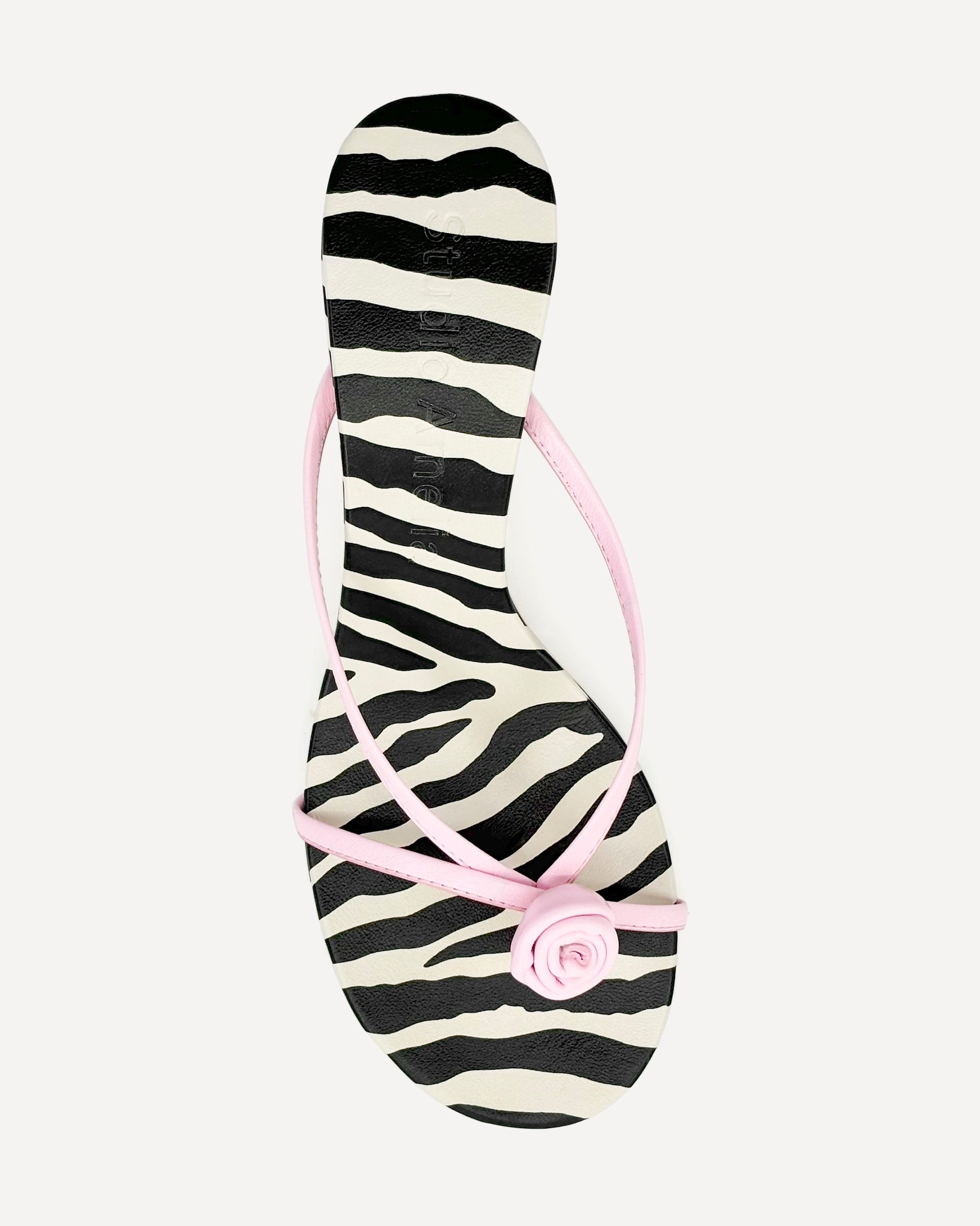 A pink leather kitten heel sandal