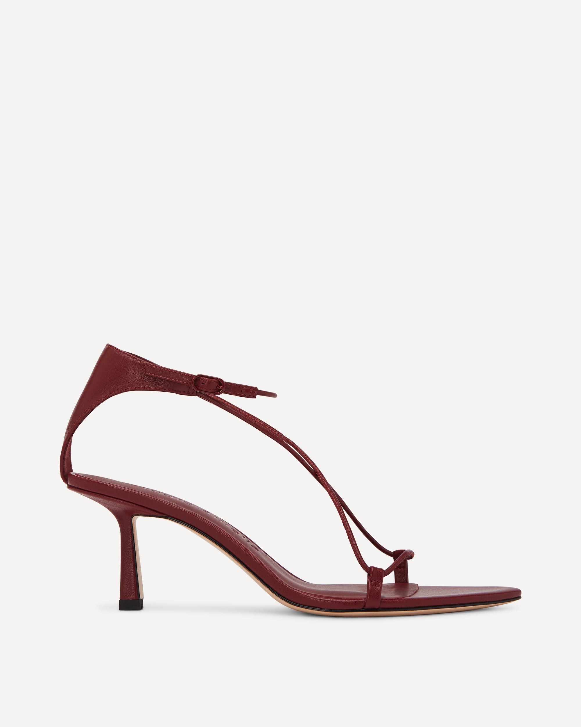 Maroon high-heeled sandal on a white background