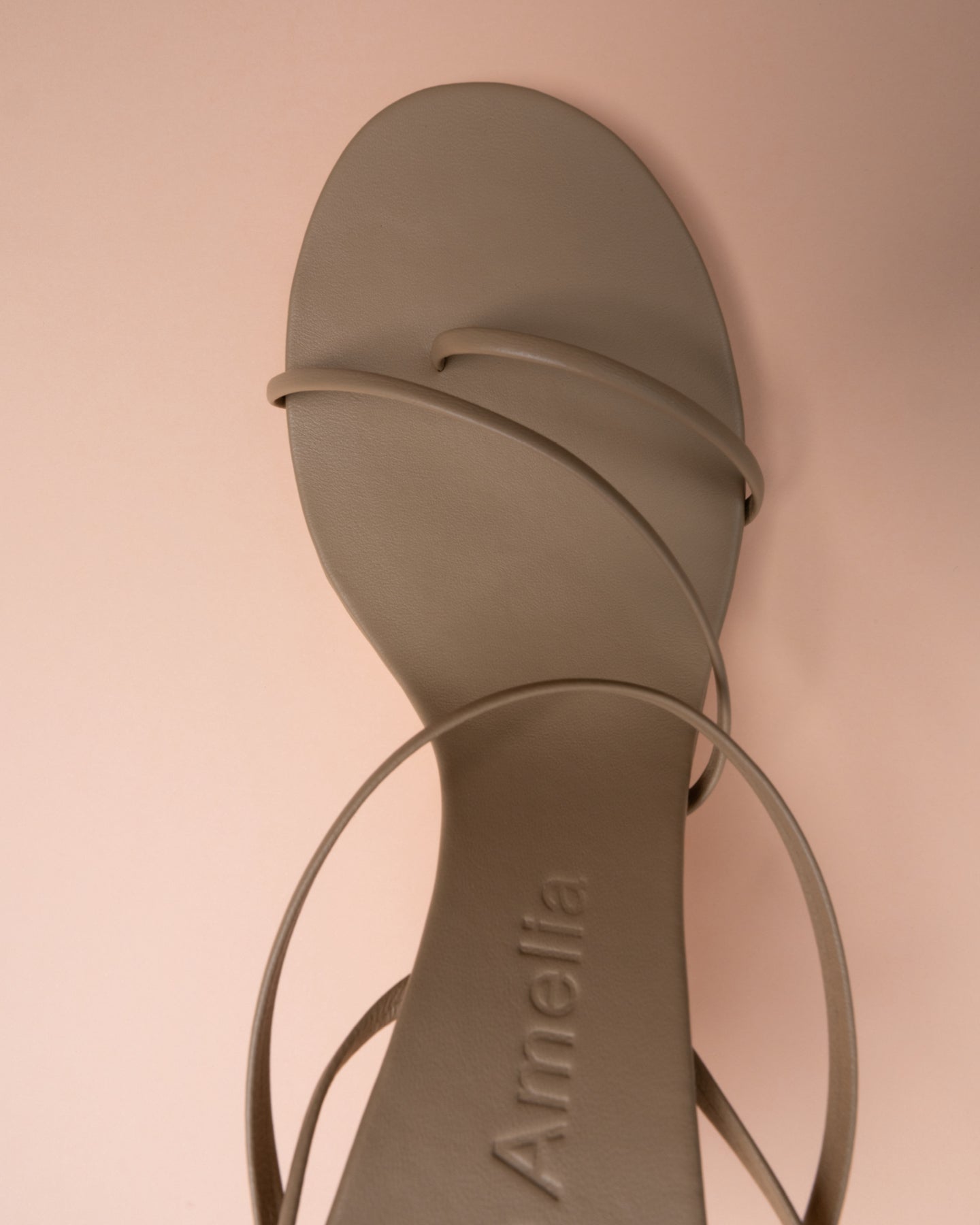 A beige sandal by Studio Amelia